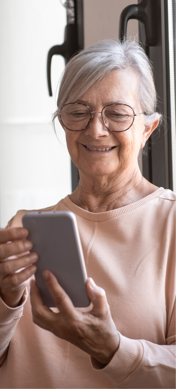 lady on phone signing up for help